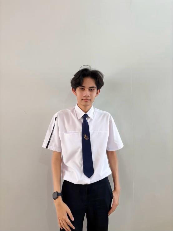 A person in a white shirt and tie AI-generated content may be incorrect.