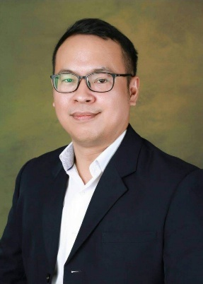 A person wearing glasses and a suit AI-generated content may be incorrect.