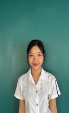 A child in a white shirt Description automatically generated