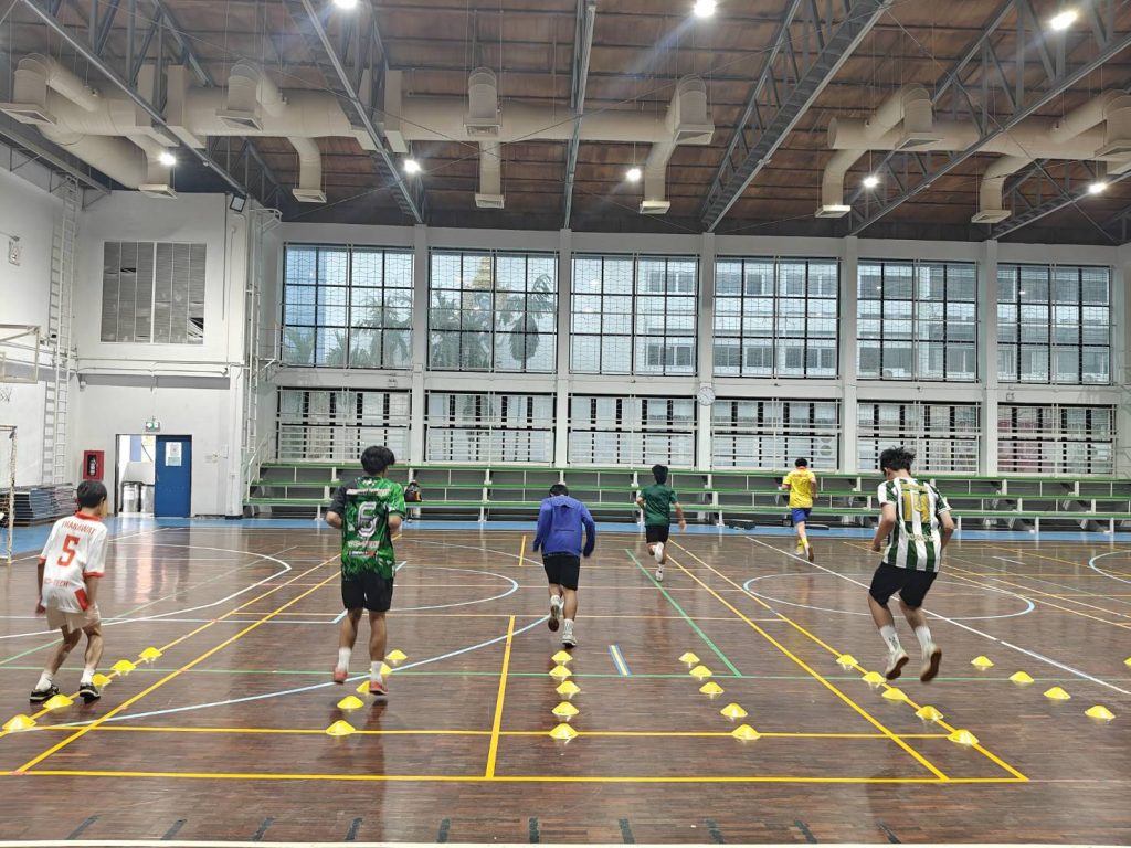 A group of people running on a court AI-generated content may be incorrect.