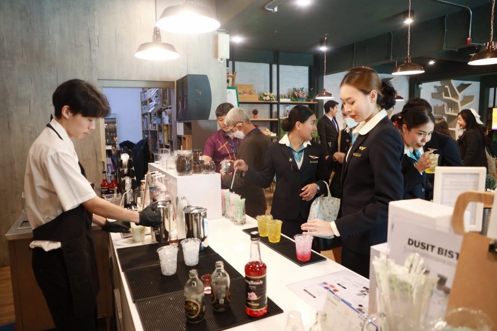 A group of people working at a coffee shop AI-generated content may be incorrect.
