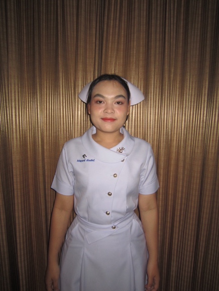 A person in a nurse uniform Description automatically generated