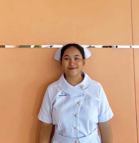 A person in a white uniform Description automatically generated