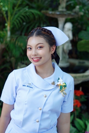 A person in a white uniform Description automatically generated